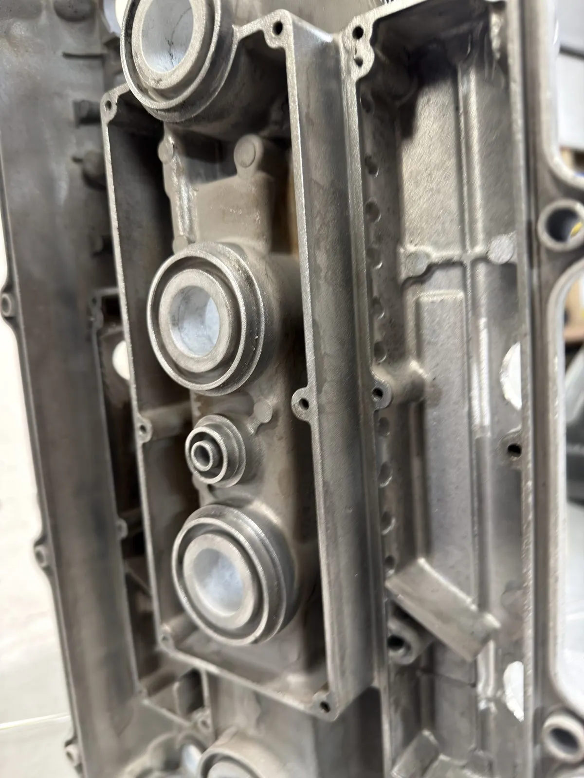 The underside of the cover showing the baffle chambers and the drilled internal passages