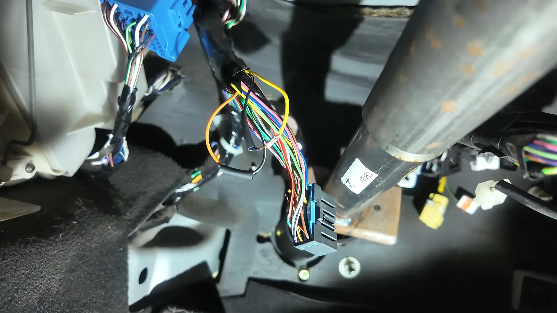The automatic transmission loom being rewired for the manual