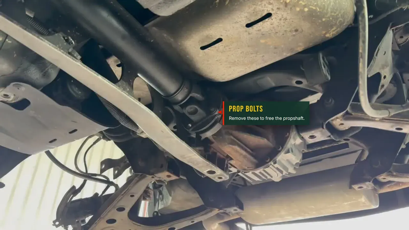 Annotated photo of the propshaft-to-diff flange and the four bolts that hold it