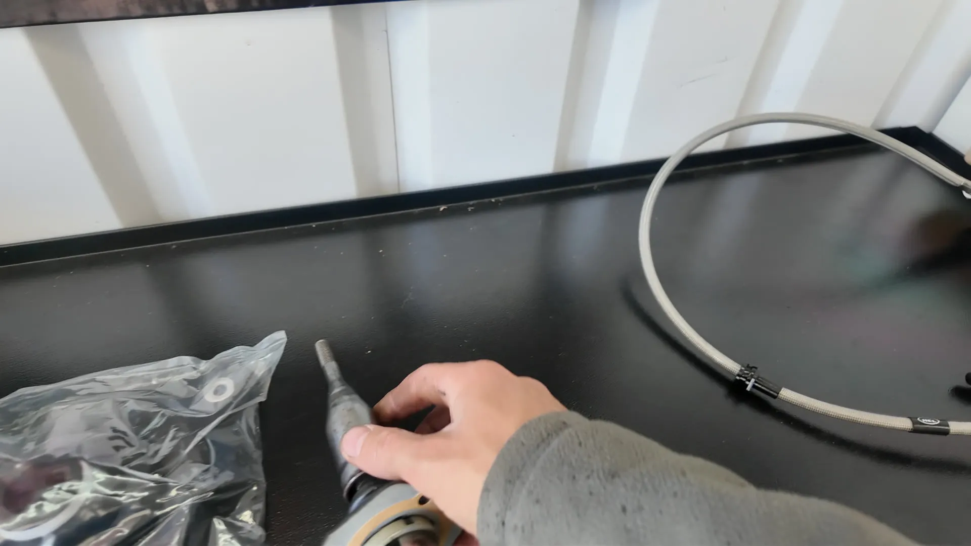A braided clutch line and a new slave cylinder on the bench