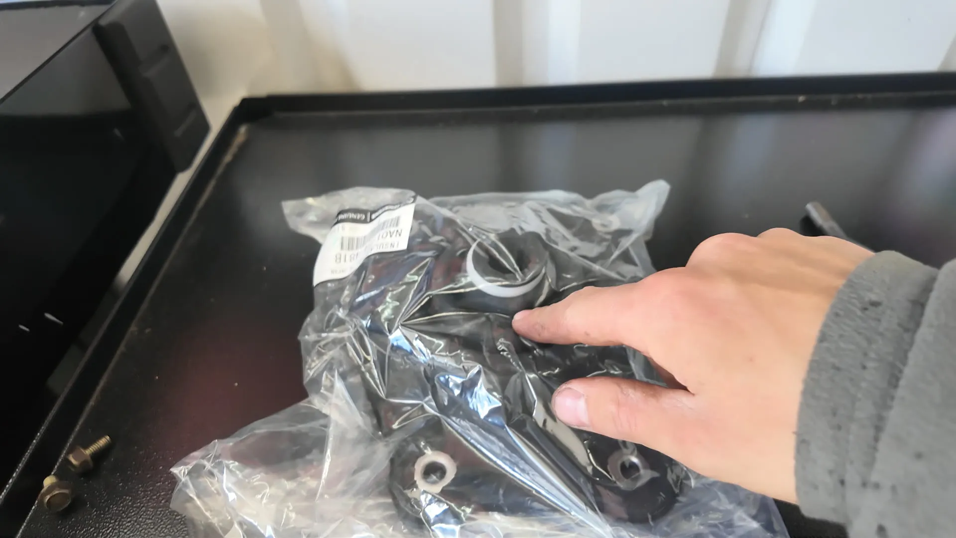 Genuine Mazda shifter parts in their packaging
