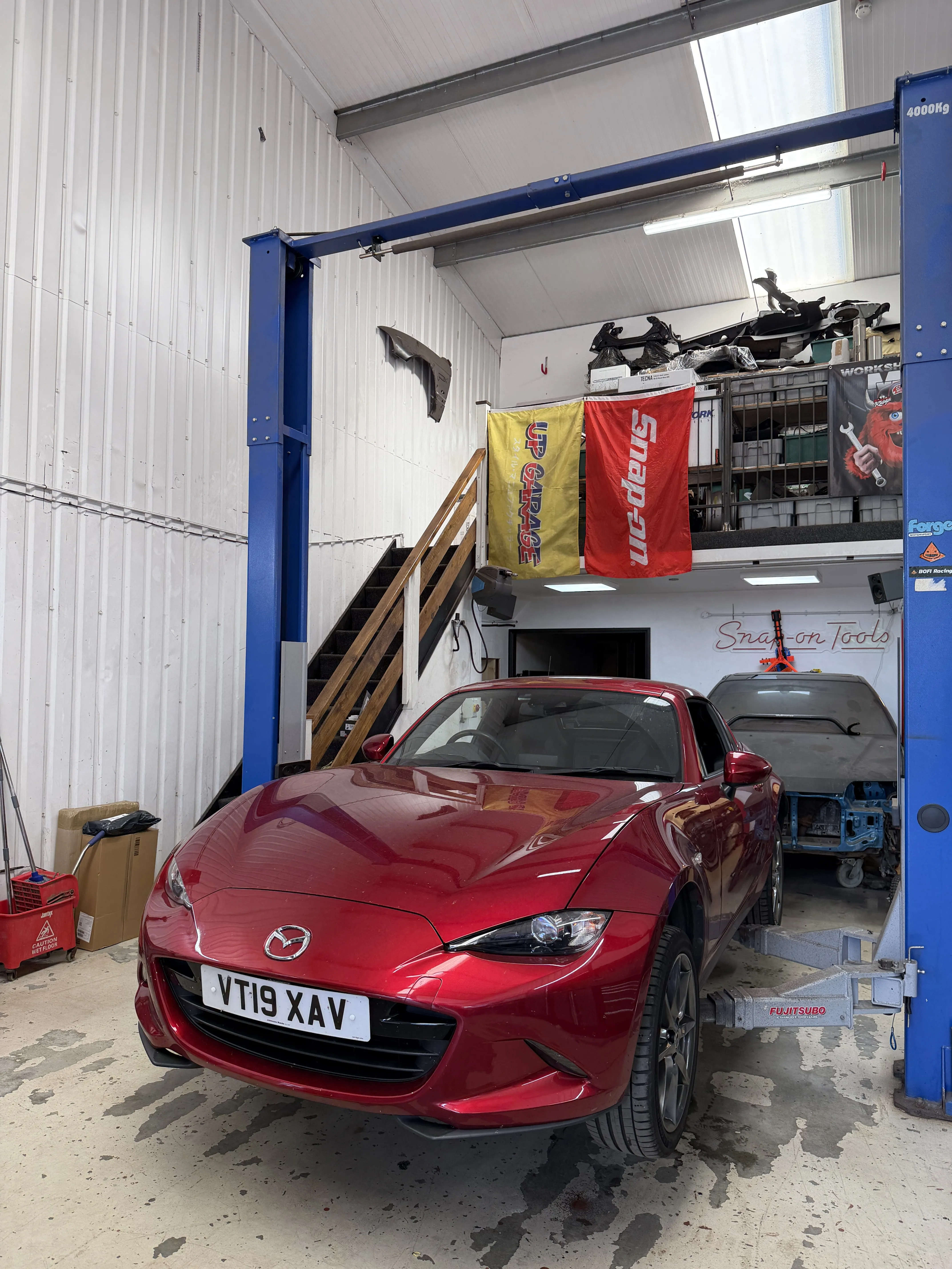 The Soul Red ND RF in the workshop on the two post lift at the start of the job