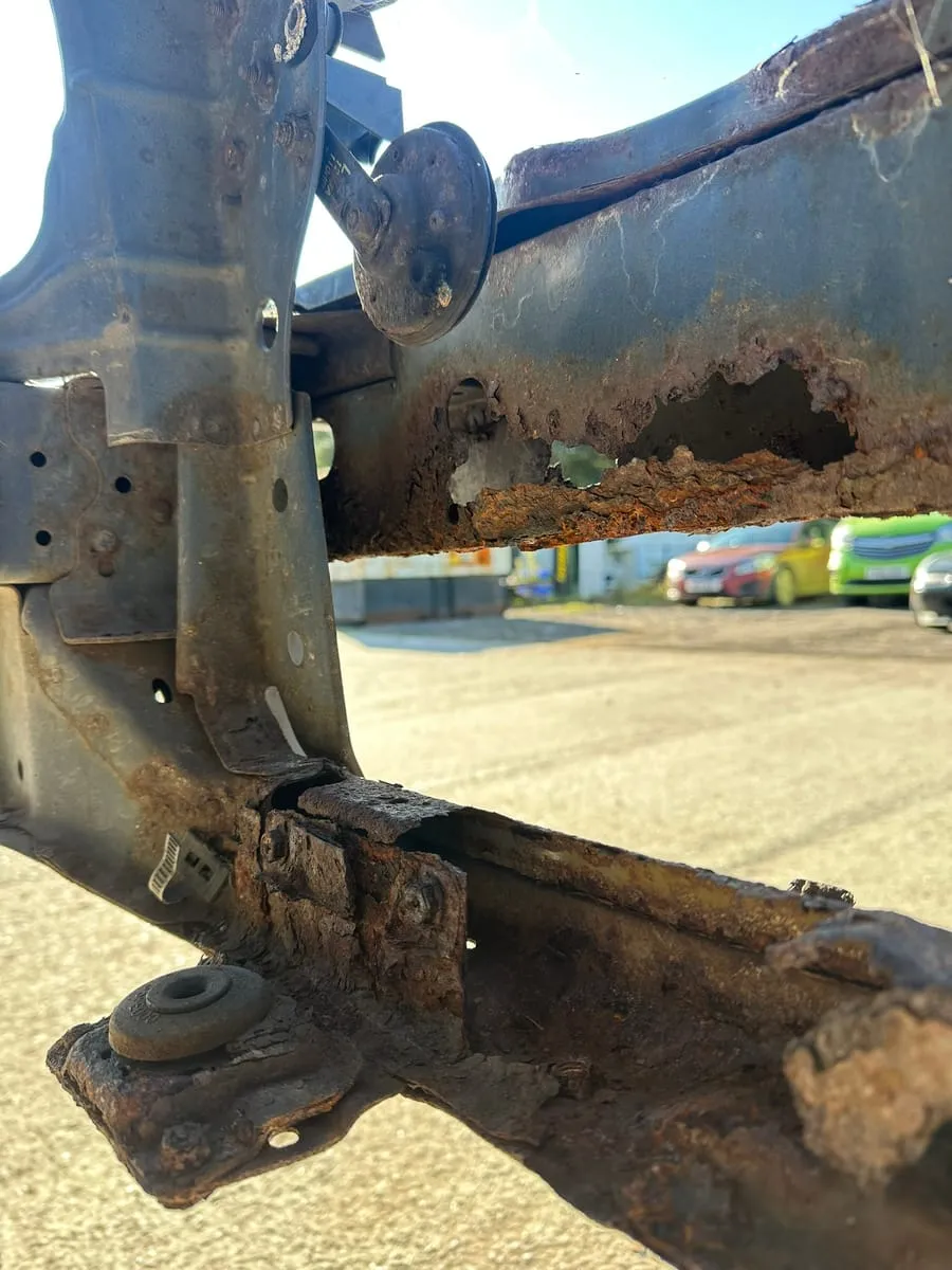 Rotten seam cut out next to fresh steel on the ramp