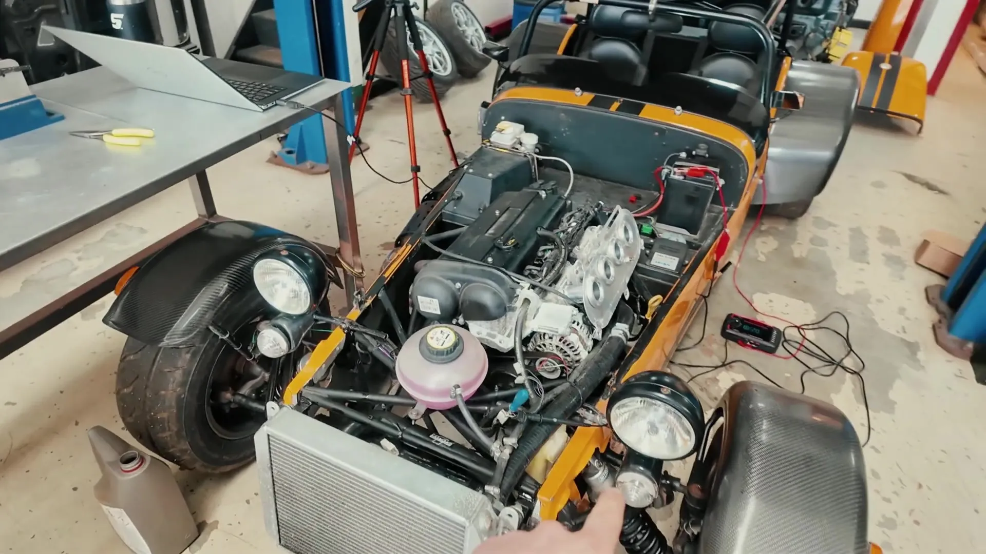 The front of the Caterham stripped for diagnosis, ECU on the bench