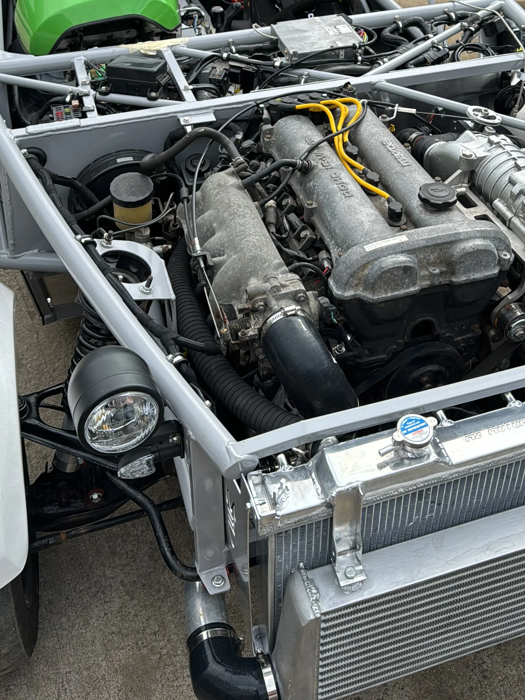 The engine bay from the front, radiator and intercooler in, 22 August 2024