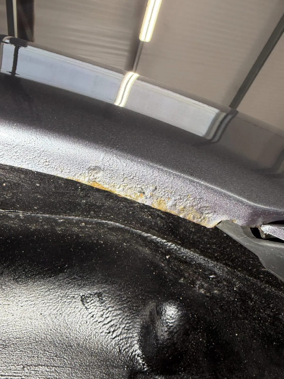 Corrosion starting along an arch seam, photographed on the ramp
