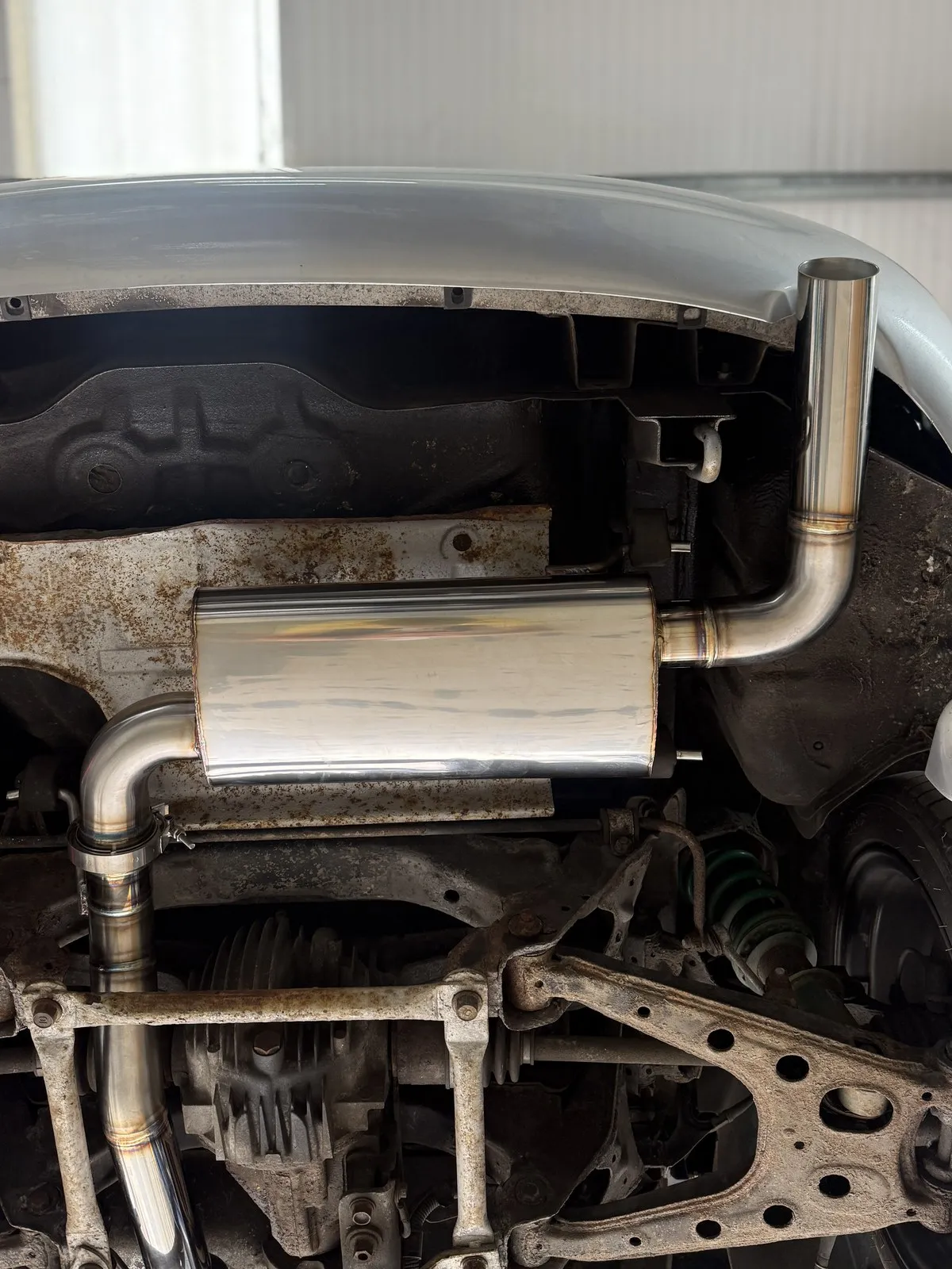 The polished stainless back box and tailpipe fitted under the rear of the car