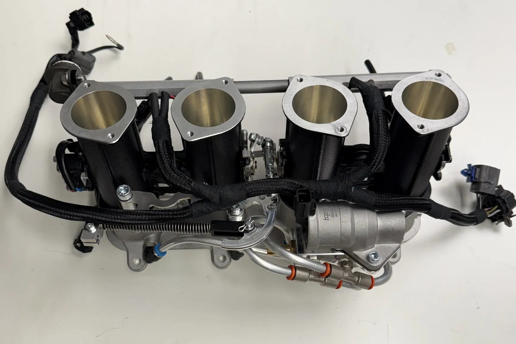 The Jenvey throttle body assembly built up on the bench, injectors, billet fuel rail and linkage fitted