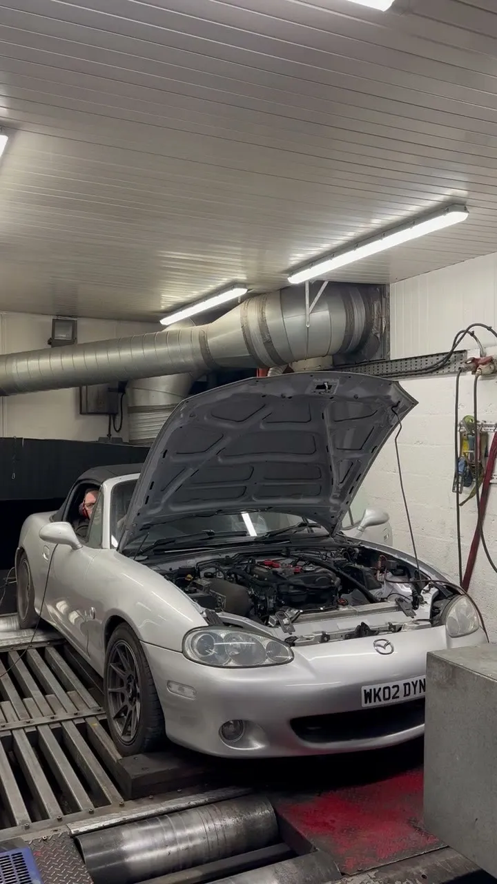 The finished Mk2.5 strapped down on the rolling road with the bonnet up