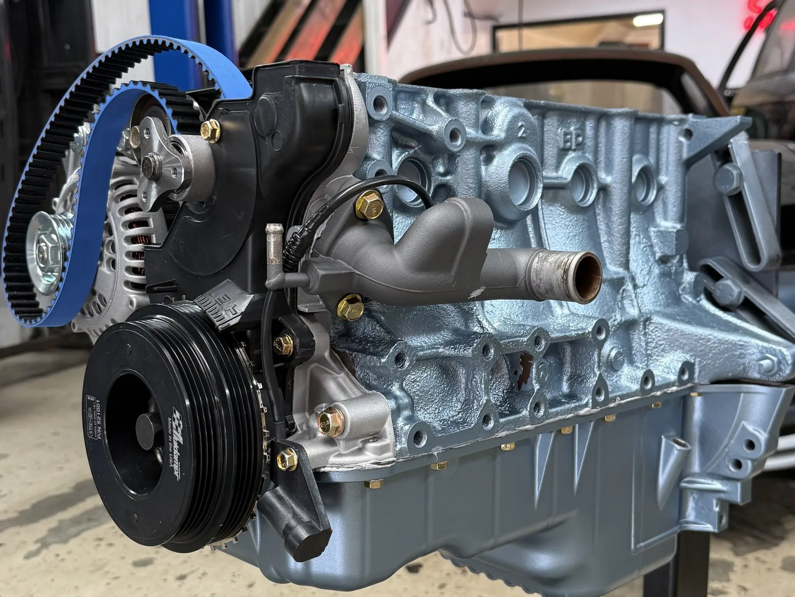 The other side of the painted short block on its stand, sump painted to match