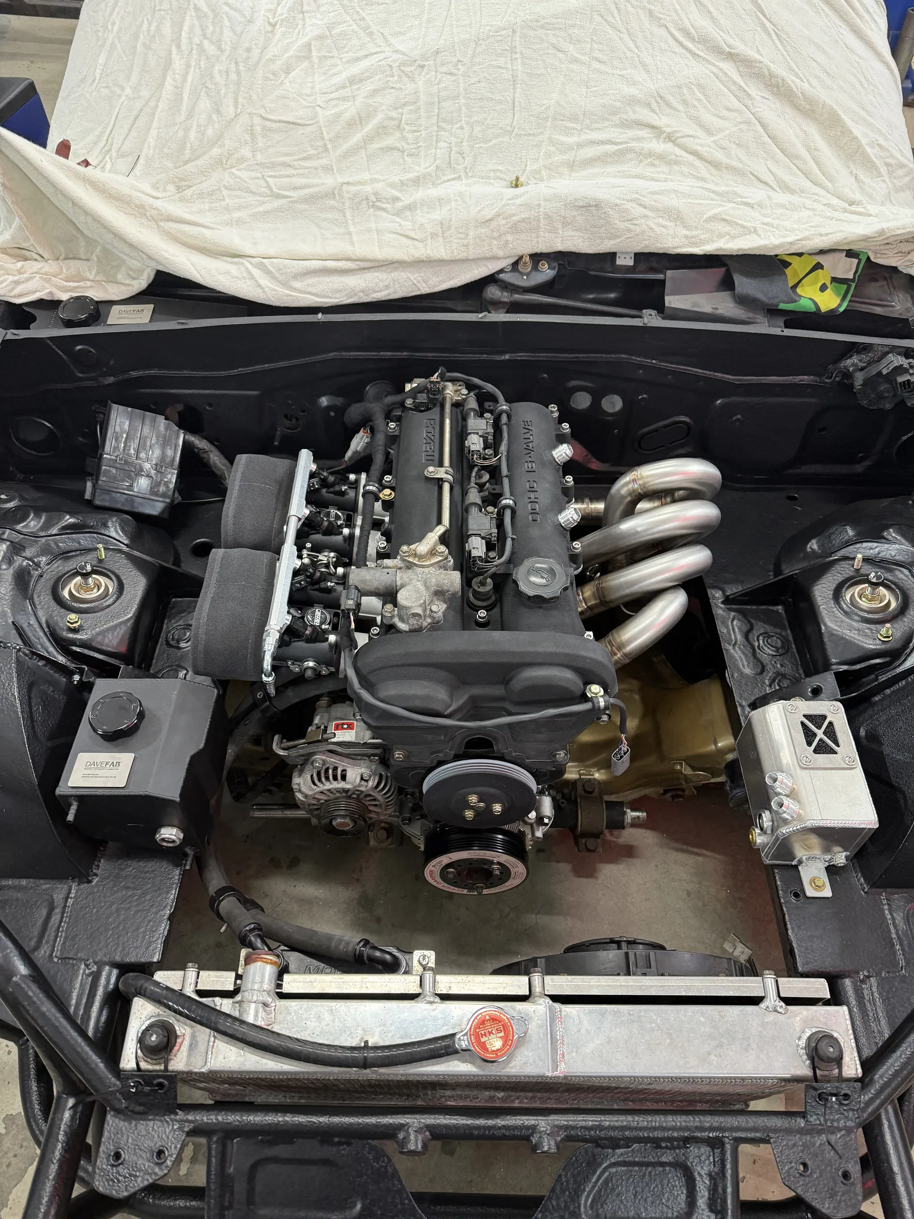 Looking straight down into the bay, all four throttle bodies and trumpets in a row
