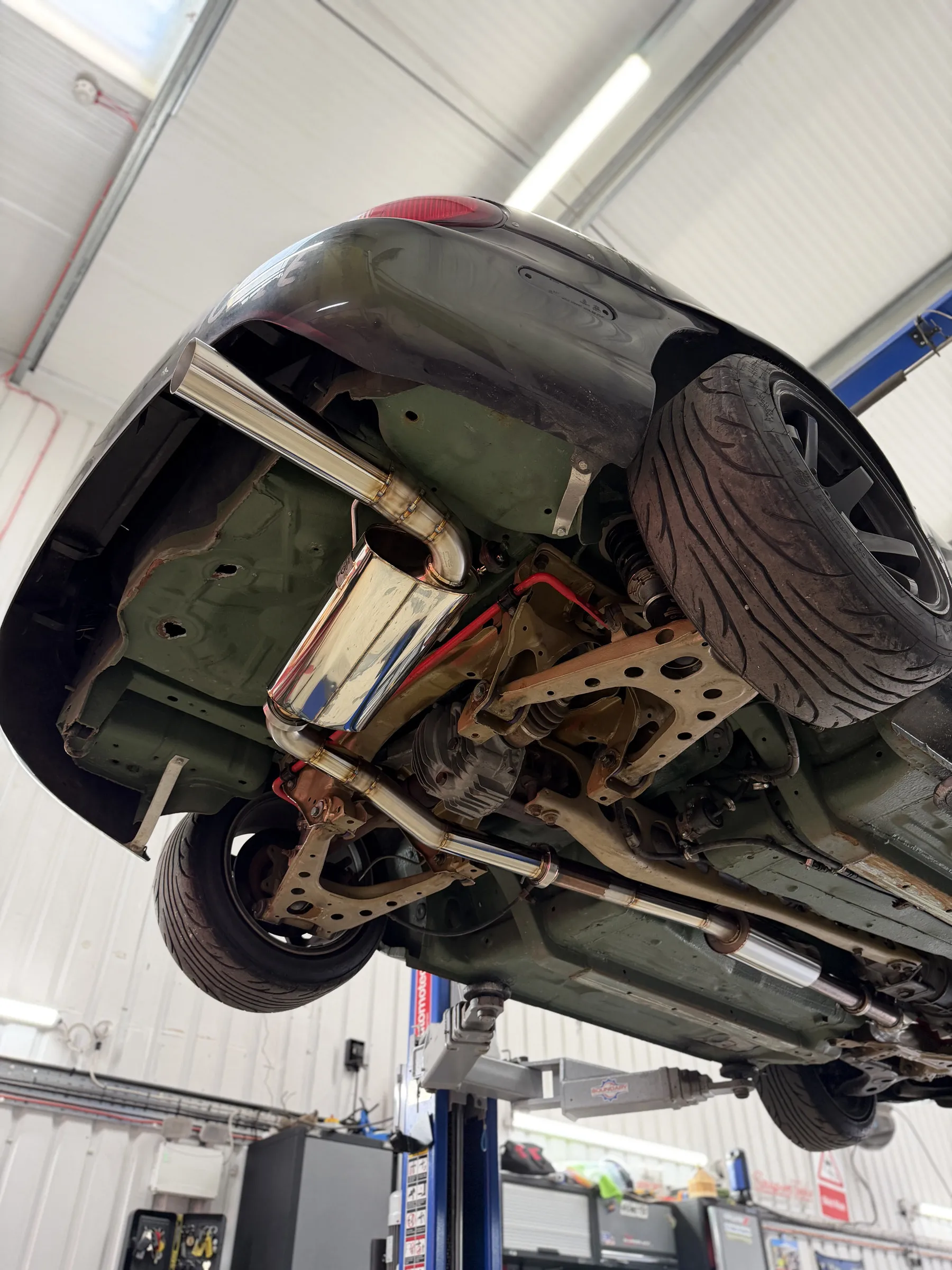 The rear of the underside on the ramp, the stainless system running back past the differential to the silencer