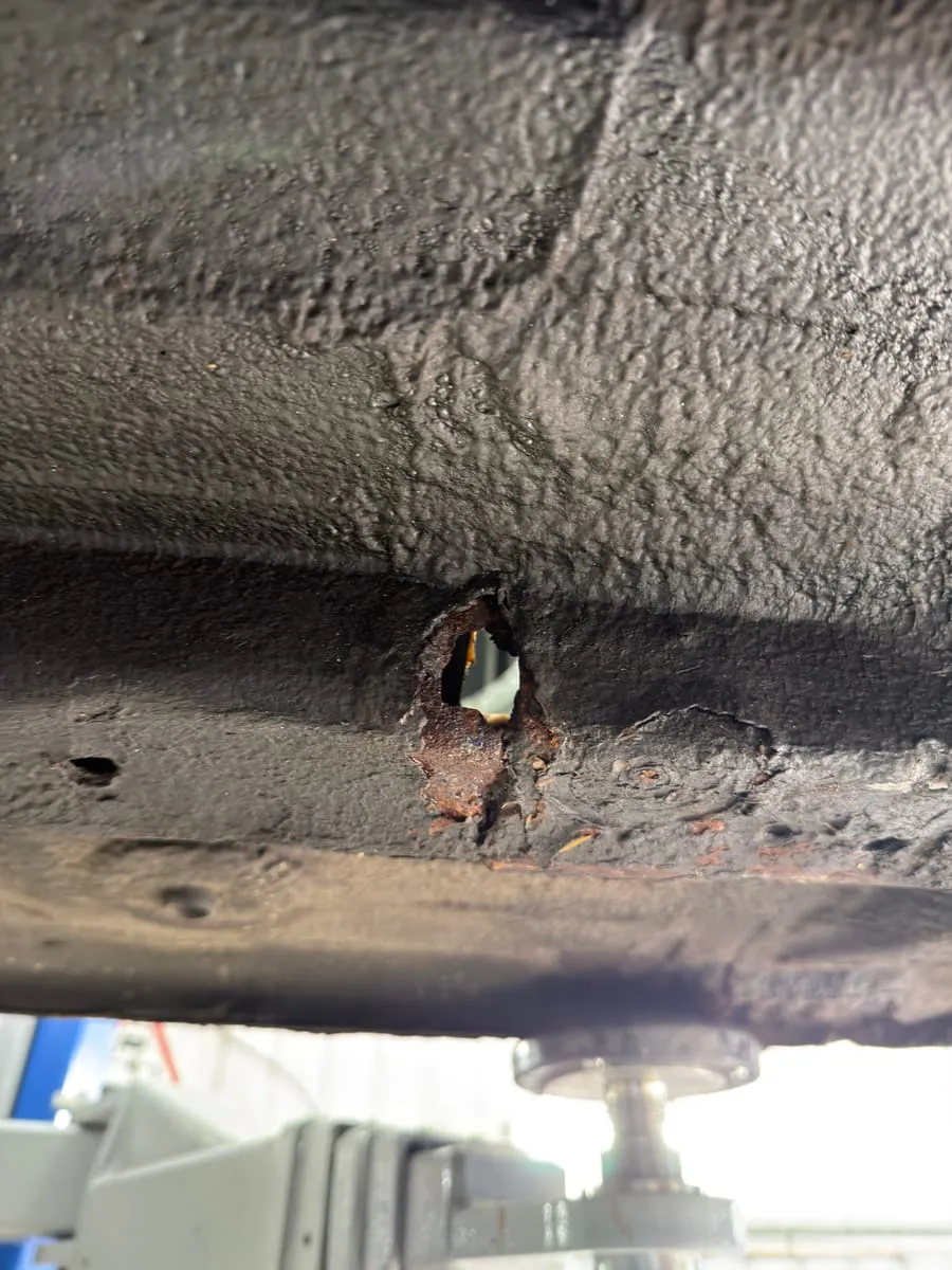Rotten chassis rail box section removed, full of holes