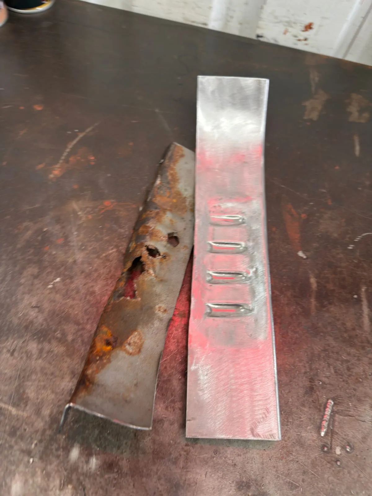 A rotten support section next to its hand-made replacement with pressed ribs