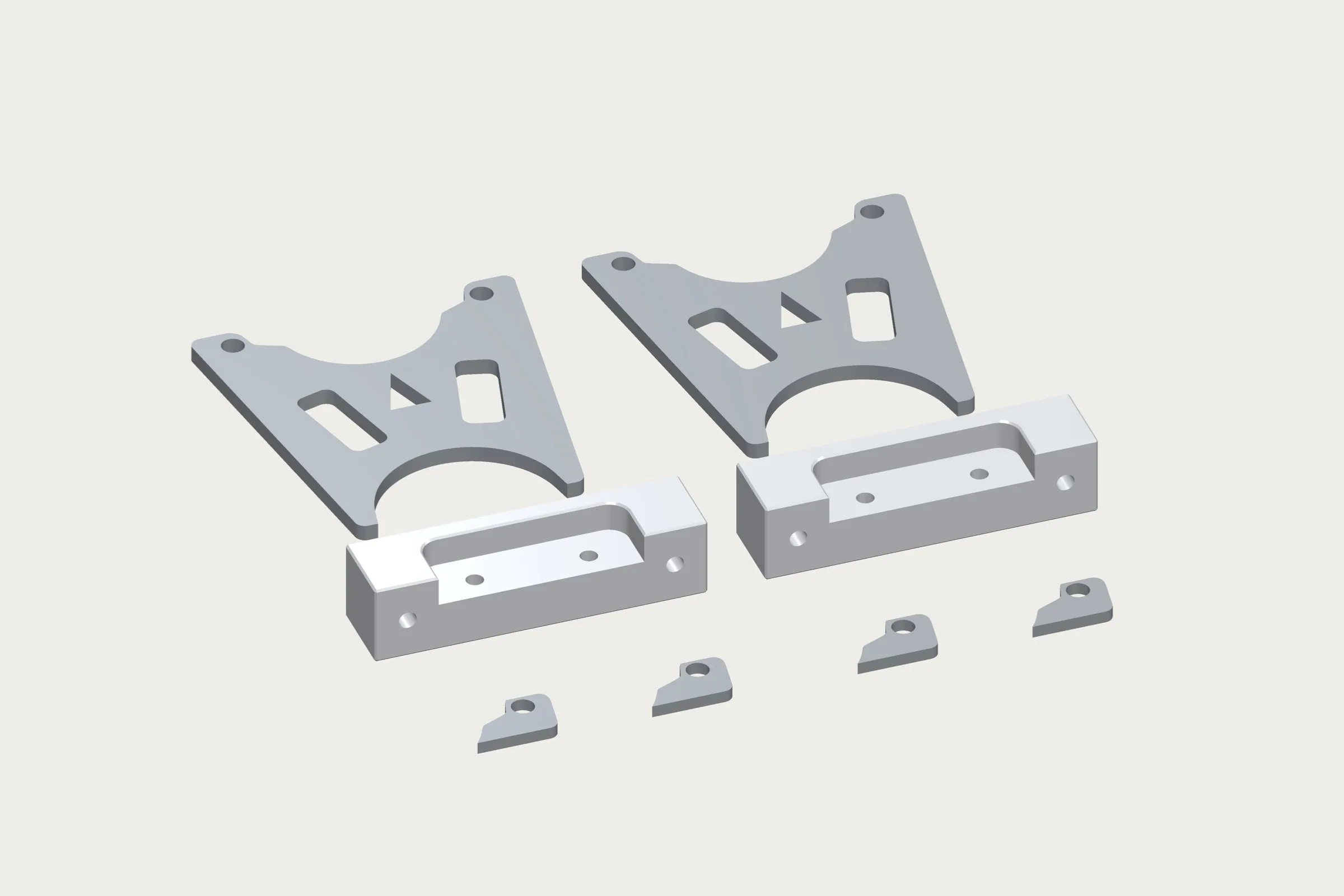 The kit laid out: two steel handbrake brackets, two machined aluminium caliper blocks and four steel spacers