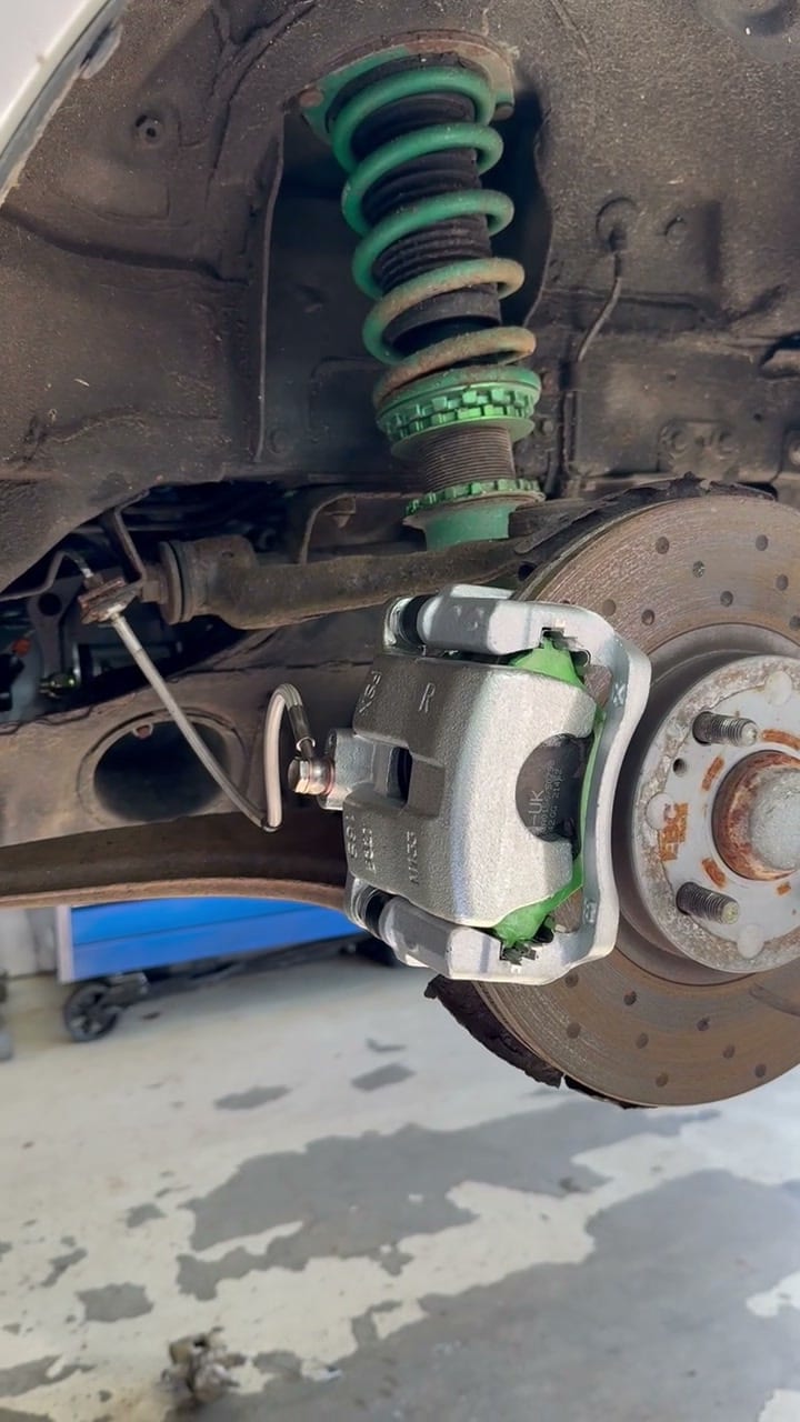 New caliper and braided line on the front, the kept cross drilled disc behind
