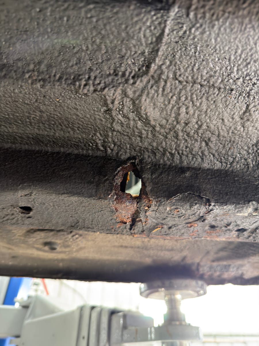 Rotten chassis rail box section removed, full of holes
