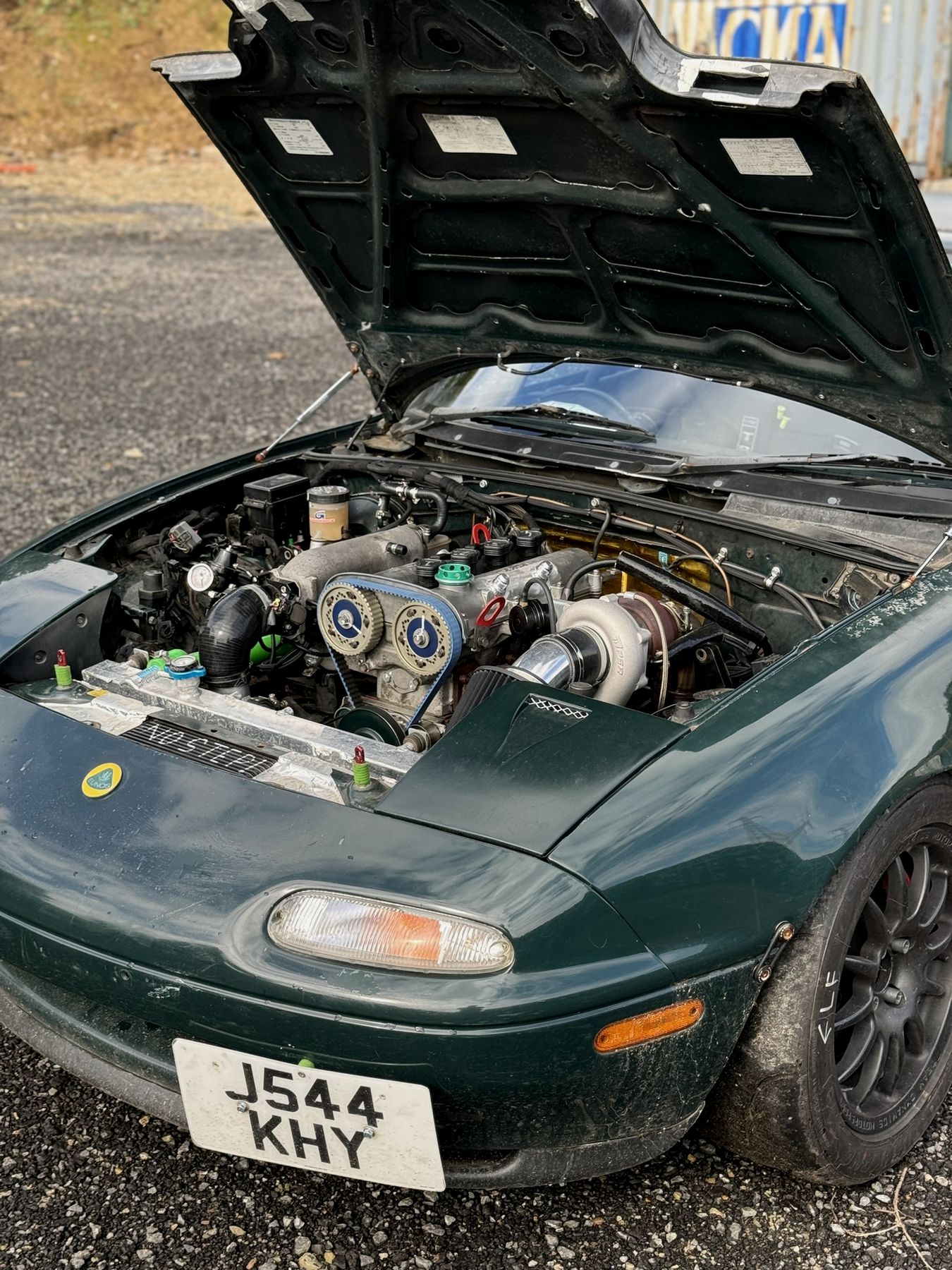 A turbocharged Mazda MX-5 engine bay with bespoke fabrication and colourful anodised fittings